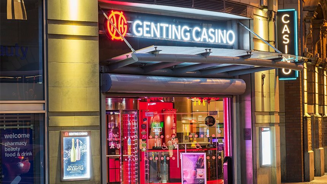 Illuminated entrance to Genting Casino Manchester on Portland Street